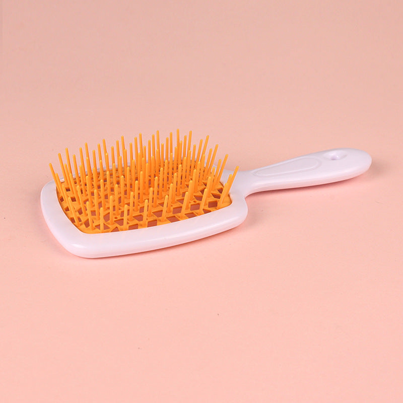 White Handle orange hair brush