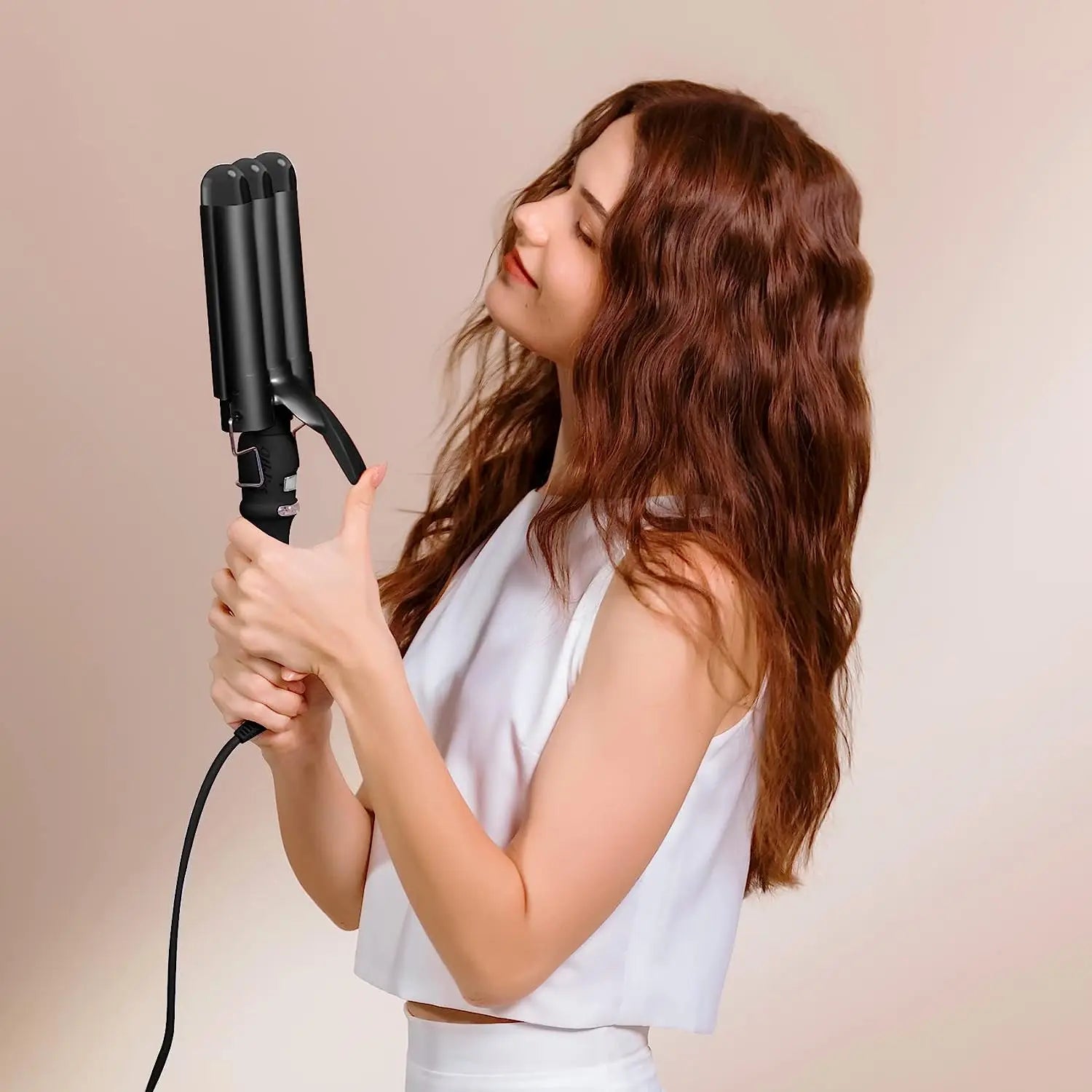 Adjustable heat settings on the Triple Hair Waver for customizable styling on all hair types.