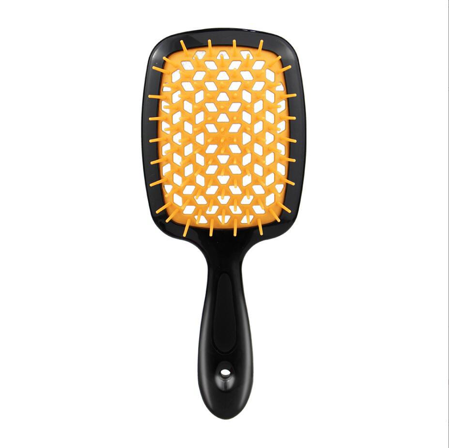 black Handle orange hair brush