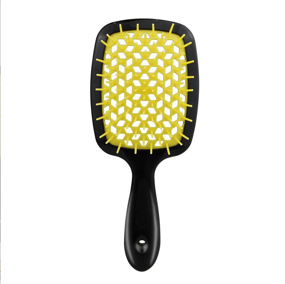 black Handle yellow hair brush